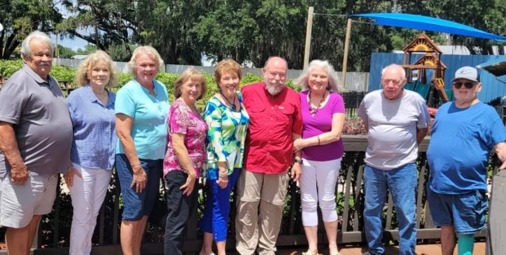 Left to right: Ronnie Mullaney, Maggie Mullaney, Ruby Perkins Wall, Peggy Walden Farkas, Barbara Franques, Bill Bender, Juliette Bender, Tom Crews, Larry St Charles. Donald Caraway & his wife, Lynda joined in for lunch but had to leave before picture take