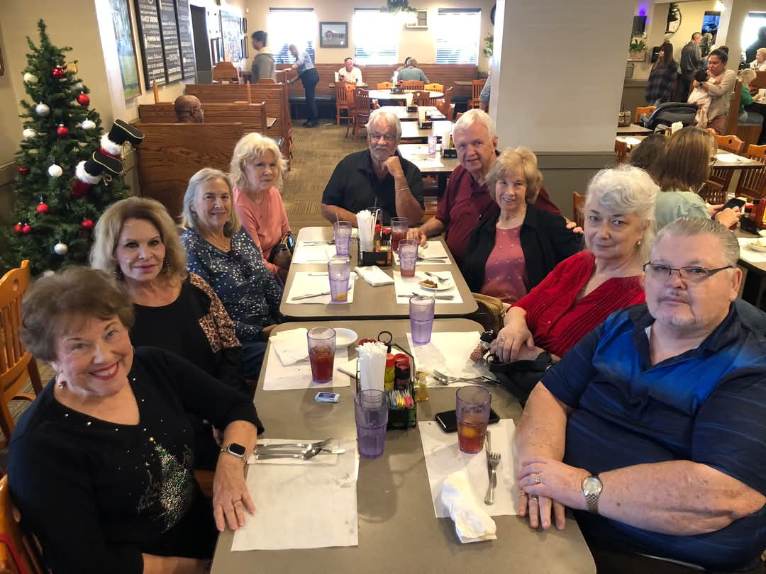 Left:  Barbara Bone Franques, Pec Chambers McGinnes,Peggy Walden Farkas, Maggie Mullaney (Ron's wife) at end: Ronnie Mullaney;  Right: Donald Caraway, his wife, Lynda, Donna Baker-Wilkes and her husband, Jim Garrett.   December 9, 2024, Fred's Market